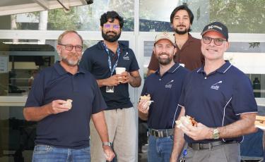 Men holding coffee during International Men's Day
