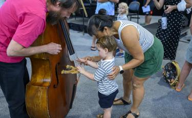 Young boy conducting orchestra