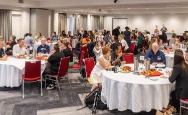 image of businesses sitting around tables