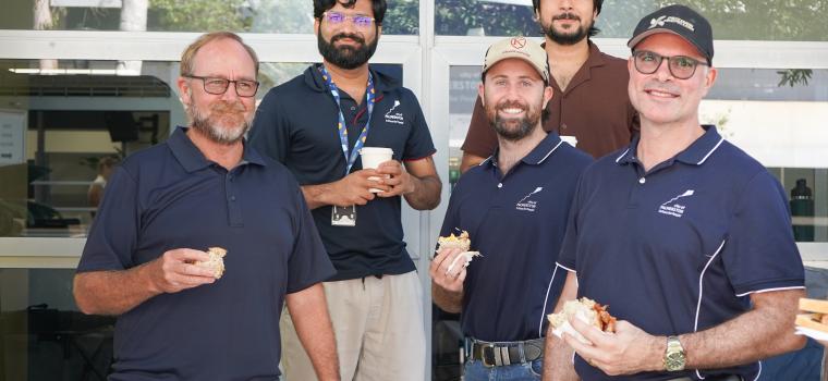 Men holding coffee during International Men's Day